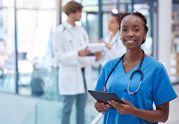 Nurse professional healthcare worker with tablet medical center clinic hospital while analyzing test result portrait frontline worker showing trust care knowledge about medicine